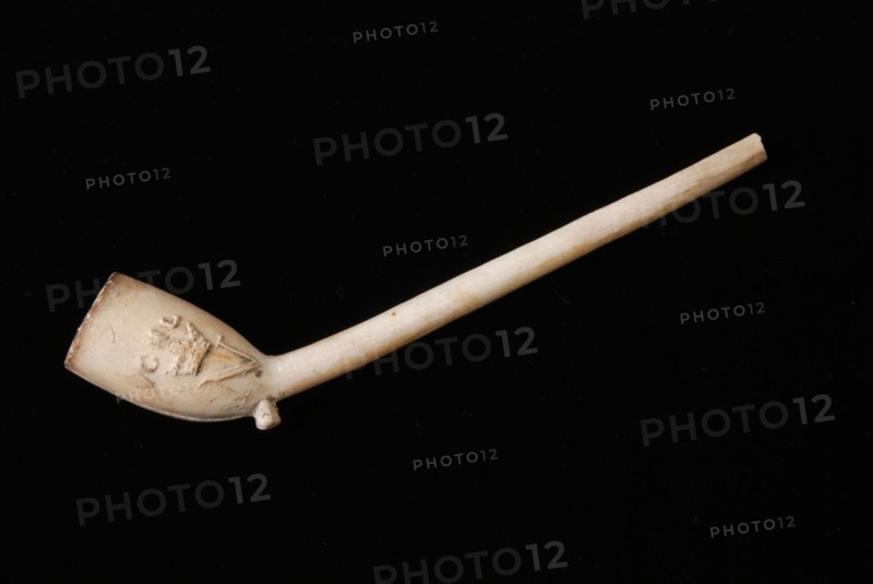 White clay pipe with embossed, crowned N and initials CHL on the boiler, clay pipe smoking equipment smoking ground find