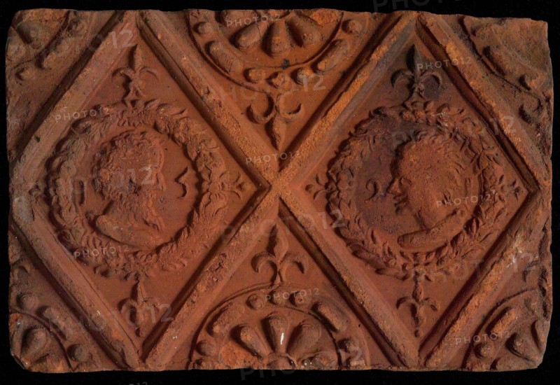Hearthstone, from Antwerp Belgium, without frame, with male and female heads, hearth part soil foundry brick, baked hearth