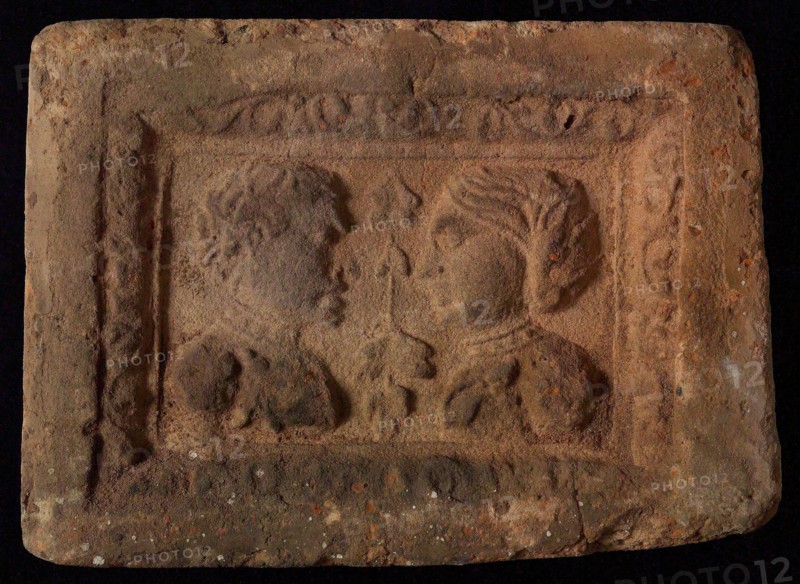Hearthstone, Luiks, from Luik, Liege Belgium, with wide frame, with male and female head, hearth fireplace component ceramics