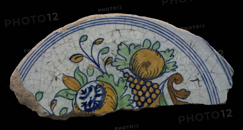 Fragments of majolica dish, polychrome, fruit bowl on one foot, plate dish crockery holder soil find ceramic earthenware glaze