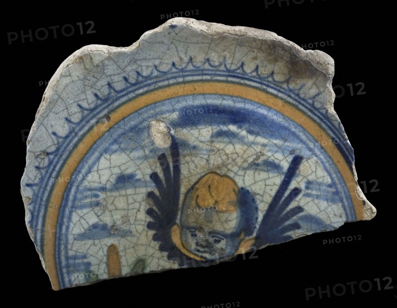 Fragment majolica dish, yellow, green and blue on white, winged cherub cup, plate dish crockery holder soil find ceramic