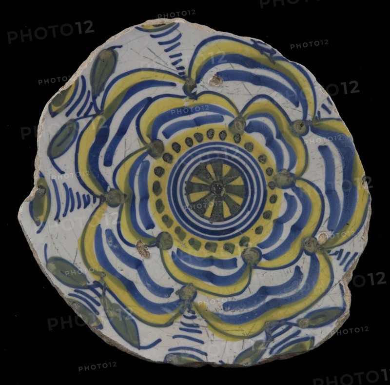 Fragment majolica dish, yellow, green and blue on white, with stylized rose (Tudor rose?), dish plate crockery holder earth