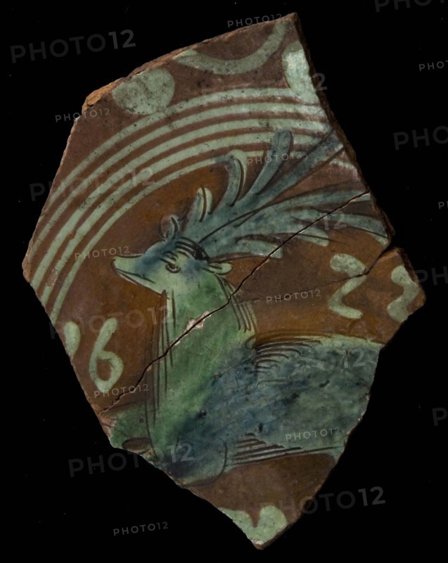 Red earthenware with drawing in light yellow and green glaze, plate crockery holder soil find ceramic earthenware glaze, year in