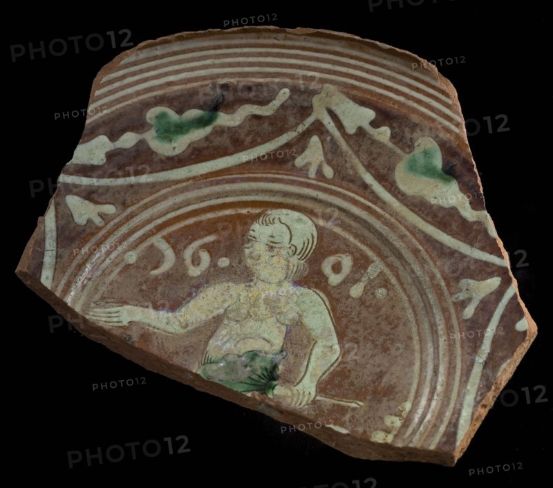Fragment Werra plate, mirror decor paradise with Eve, year 1601, light yellow and green glaze, border decoration bows and leaves