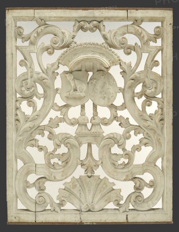 Cutting frame with two weapons under crown surrounded by curly ornaments, cutting window toplight carvings sculpture footage