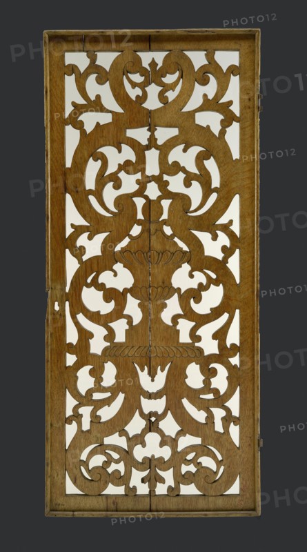 Oak toplight with carved antique vase, surrounded by curl ornaments, cutting window toplight carvings sculpture footage wood