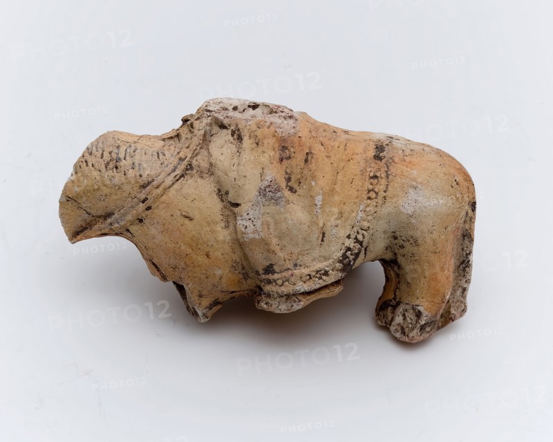 Part of pipe image, depicting horse with rider in long cloak, sculpture visual material soil finds ceramic pipe earth, in mold