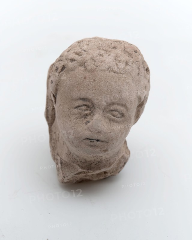 Part of pipe image, child's head, sculpture visual material soil finds ceramic pipe earth, in mold formed baked Children's head