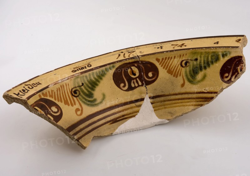 Three fragments of yellow dish, with brown and green décor of lines and rosettes, dated, dish crockery holder soil find ceramic