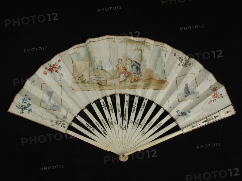 Folding fan with bone frame with stylized motifs and metal foil, both front and back painted parchment sheet with lady and