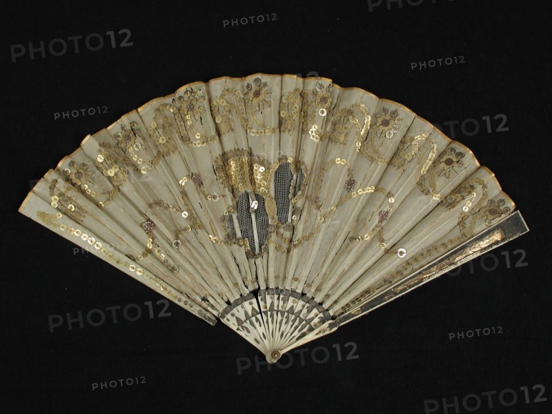 Folding fan with bone frame with foil, fan blade of cream-colored silk with tulle incrustation and gold colored sequins, folding
