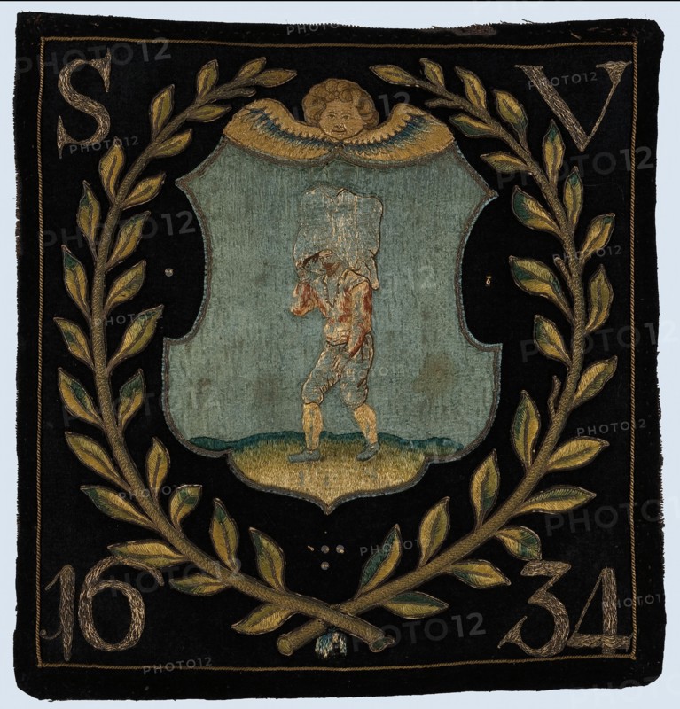Blazon of black cloth with application depicting bag carrier, blazon coat of arms information form wool cotton linen burlap