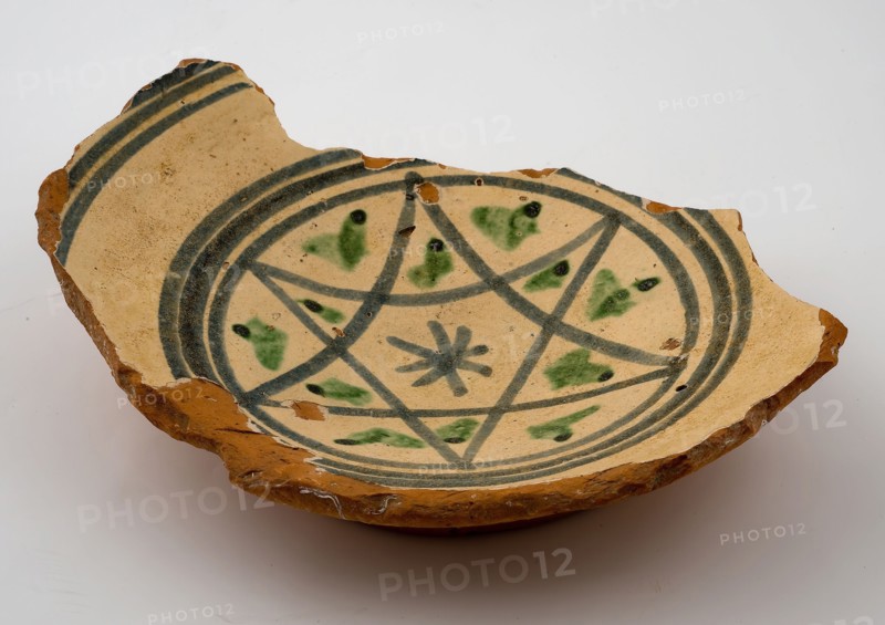 Fragment red earthenware bowl with white background and blue star shape with green accents, bowl dish bowl tableware holder soil