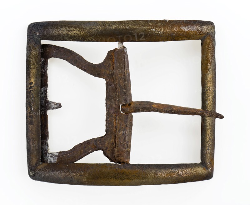 Buckle with rectangular, curved handle, middle post and angel, buckle fastener component soil find copper iron metal, archeology