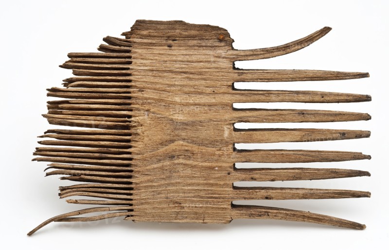 Wooden comb with coarse teeth on one side and fine teeth on the other side, comb soil finds timber, sawn Fragment wooden comb