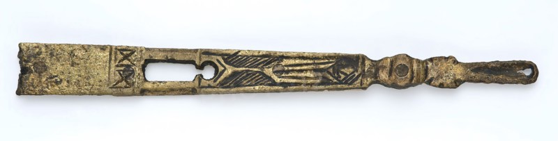 Brass tongue, long and narrow, ending in an oval eye, engraved decoration, fitting belt accessory soil find copper brass metal