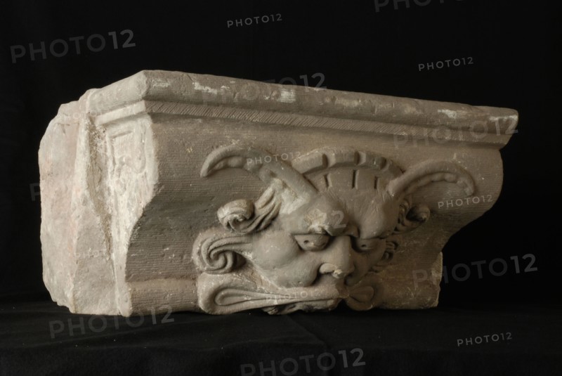 Console with devil's head, console building element sandstone stone, sculptured bombardment Rotterdam City Triangle Newport