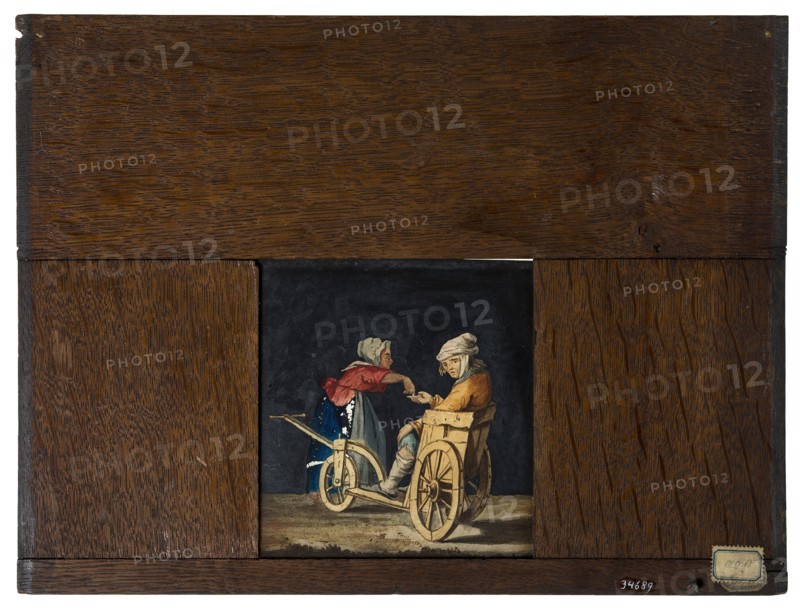 Hand-painted glass plate in wooden frame for illumination cabinet, image of disabled man in cart with alms giving wife