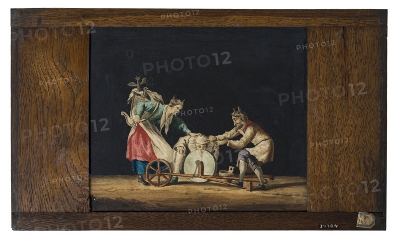 Hand-painted glass plate in wooden frame for illumination cabinet, image two devils, clown and sharpening stone, slide plate