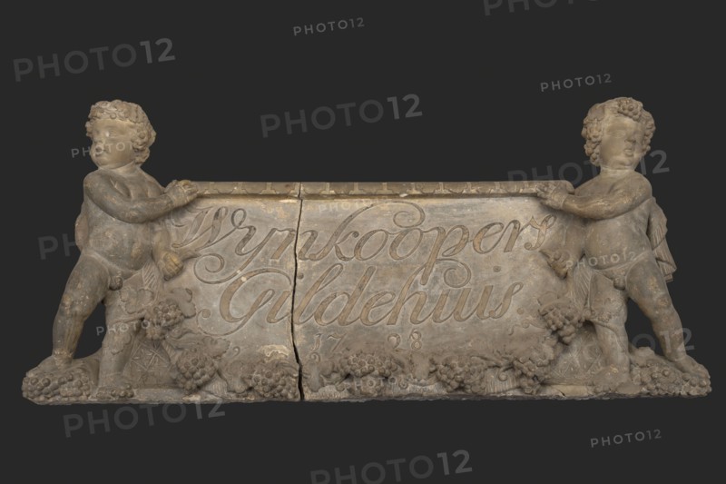 Jacob Janssens of Janson, Facade stone with two putti, vines and Wijnkoopers Gildehuis Ao 1728, facing stone sculpture sculpture