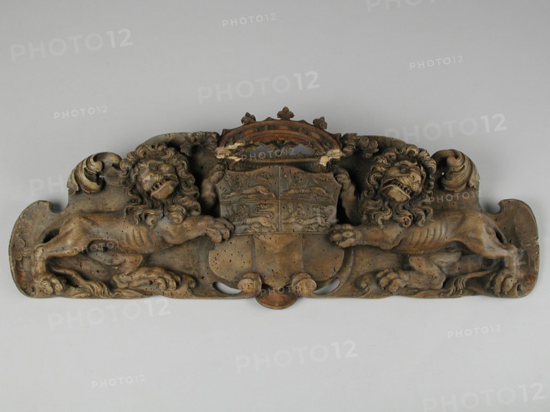 Carved city coat of arms of Rotterdam, two lions holding crowned coat of arms, coat of arms information form carvings sculpture