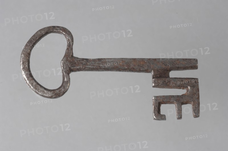 Iron key with heart-shaped eye, massive key handle and cruciform beards in beard, key iron value soil find? iron, hand forged