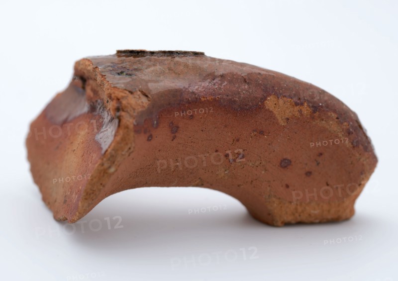 Fragment of red earthenware, partly glazed, fragment crockery holder kitchen utensils earthenware ceramics earthenware glaze