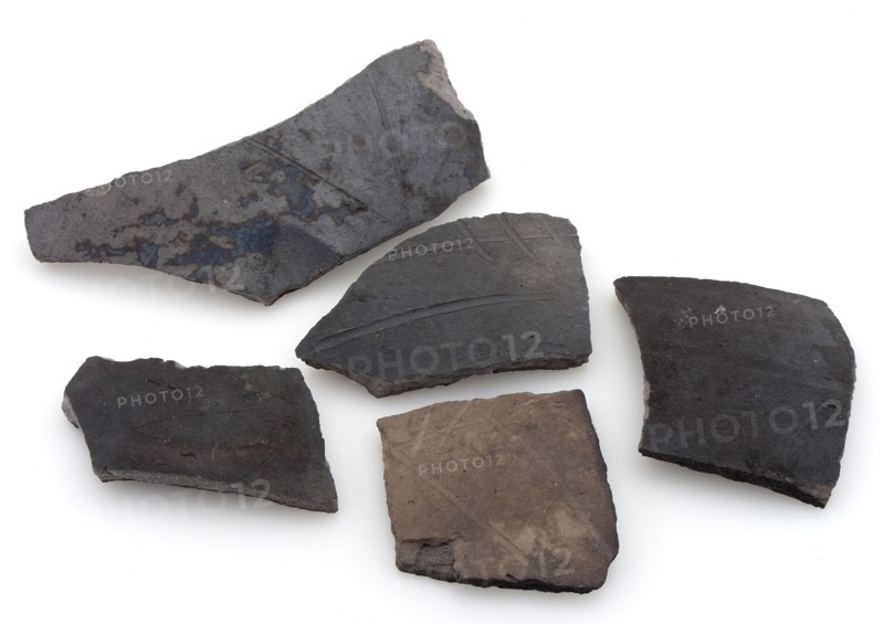 Fragments of cooking pots, dark earthenware, decorated with incised lines, cooking pot crockery holder kitchen utensils fragment