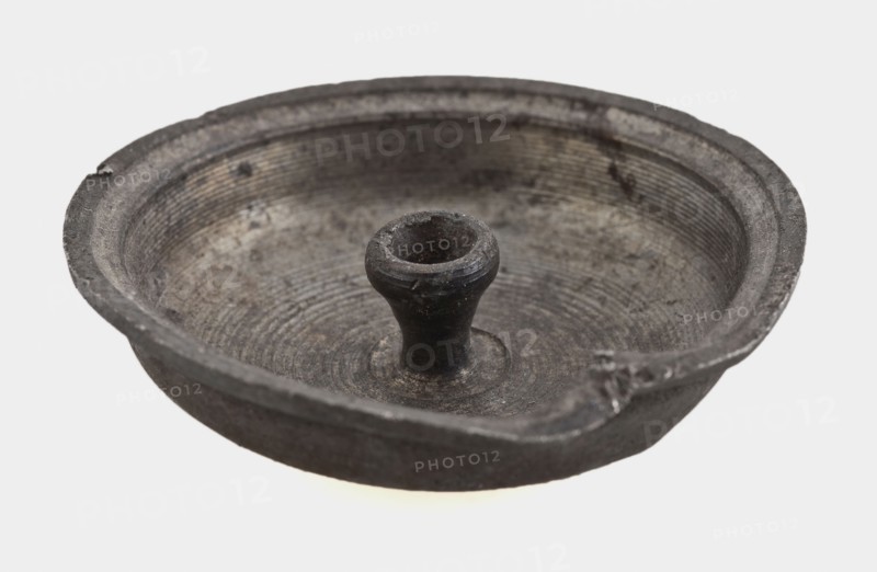 Small tin lid, lid closure soil found metal tin, molded tin lid. Curved flat and protruding edge In the middle at the bottom
