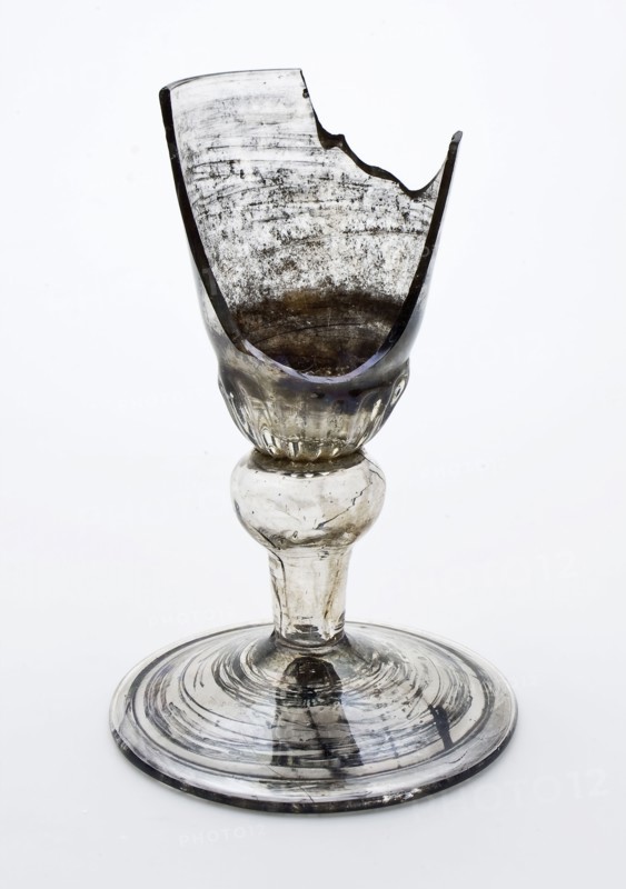 Fragment of the foot, trunk and part of the calyx goblet, drinking glass drinking utensils tableware holder soil find glass, cm