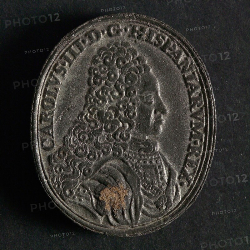 Oval coin on Charles III of Spain, penning image material tin, bust of Charles III to the right omschrift: CAROLVS. III. D.G