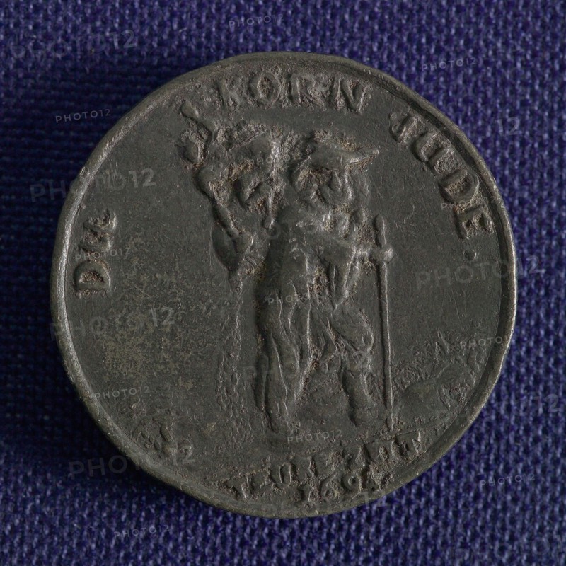 Medal on the increase of grain prices in Germany, medallion medals lead metal, man walking to the right carrying bag