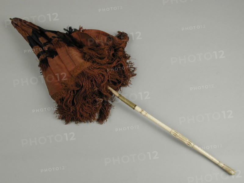 Carriage umbrella with side, brown and black trim, trimmed with long brown fringe, white, wooden and legs handle, car umbrella