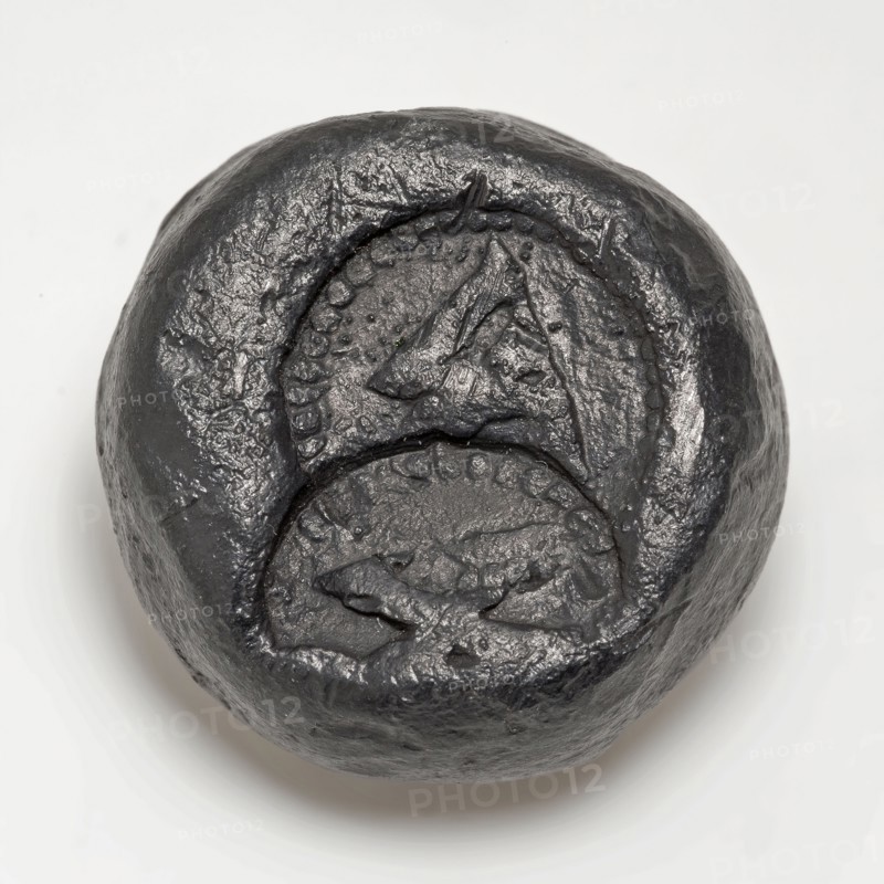 Conical, lead weight of eighth pound with calibrations, gram cast Flat round disc. Tapered calibration marks Topside stamped