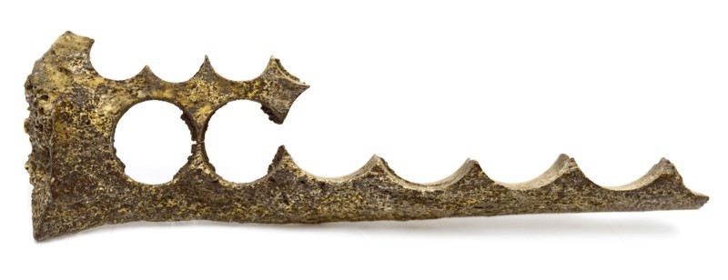 Legs block with row of holes, residue of button fabrication, waste soil found leg, drilled Fragment leg in which round holes