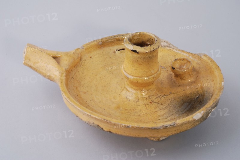 Yellow glazed earthenware candlestick, with handle and candle holder, sconce candlestick lighting means floorfound ceramics