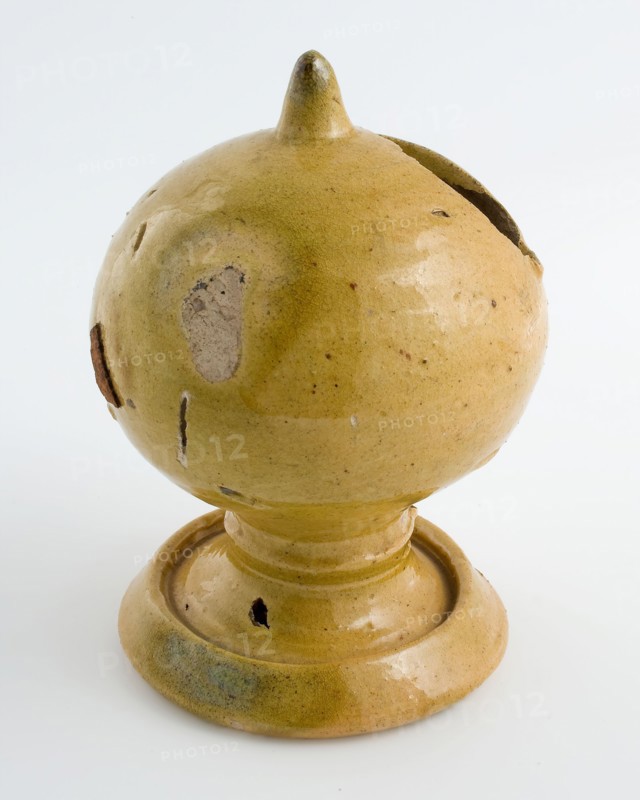 Yellow glazed piggy bank, ball with slot, on foot, piggy bank holder earth discovery ceramic earthenware glaze lead glaze, hand