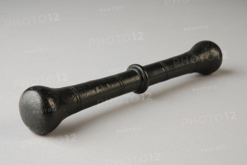 Bronze stamper, pestle tools equipment bronze, cast Round handle with profiled node in the middle At the ends pear-shaped