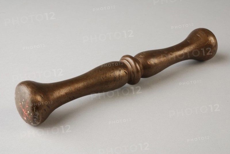 Bronze stamper, pestle tools equipment bronze, cast Pestle: round stem with central node. Bolls on both sides of node.
