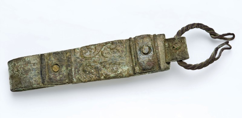 Belt hanger or belt hook with long folded lip, two riveted friezes, belt accessory soil find brass bronze metal, eye) 6,7 cast