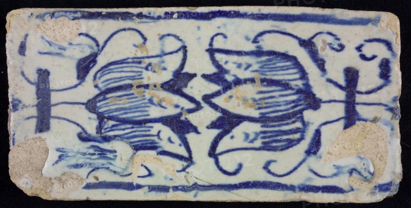 Blue border tile, waving floral pattern with tulips, above and below blue border, edge tile wall tile tile sculpture ceramic