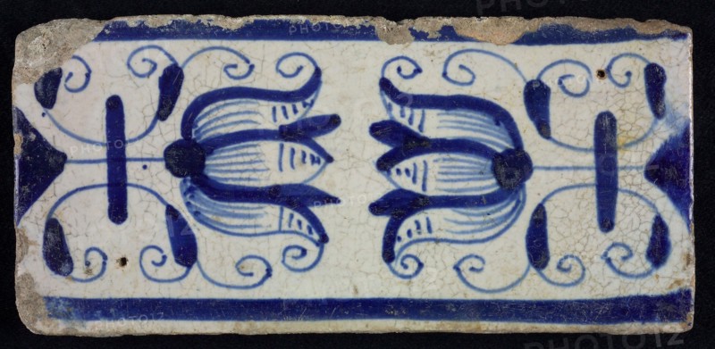 Blue border tile, waving floral pattern with tulips, above and below blue border, border tile wall tile tile sculpture ceramic