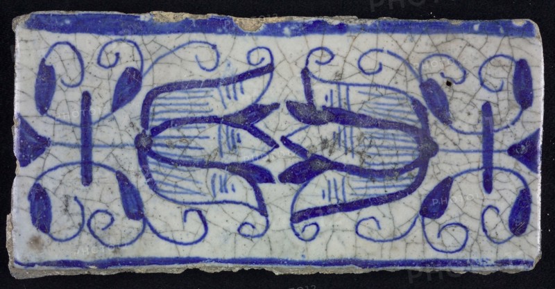 Blue border tile, waving floral pattern with tulips, above and below blue border, border tile wall tile tile sculpture ceramic