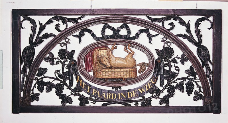 Carved cross-light and entitled: The Horse in the Cradle, cutting frame light wood carving sculpture sculpture building part