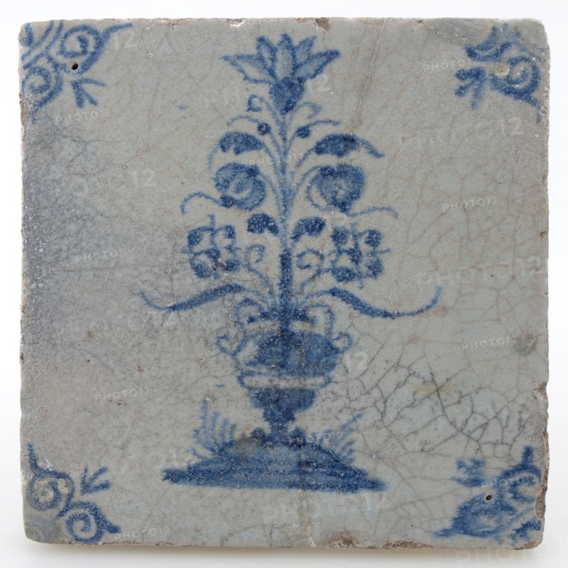 Pottery tile with flower vase and ox head corner decoration in blue on white background, wall tile tile visualization earth