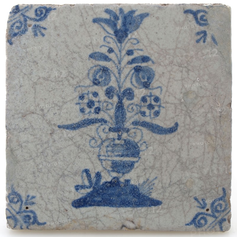 Pottery tile with flower vase and ox head corner decoration in blue on white background, wall tile tile visualization earth