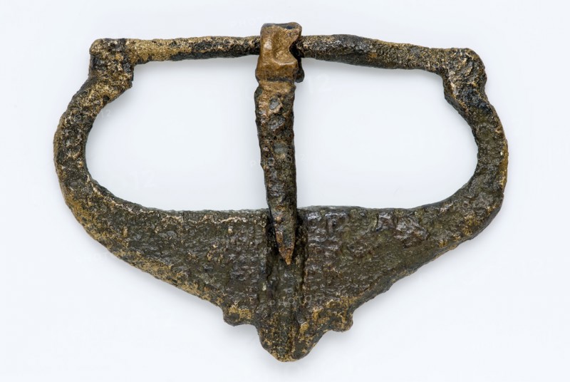 Buckle made of copper or bronze, cast with decorative outside shape, buckle fastener component soil find brass bronze metal