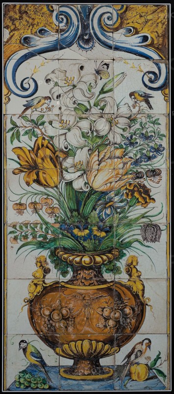 Polychrome tile picture, decorated flower vase, above two birds, down bird at bunch of grapes and pomegranate, tile picture