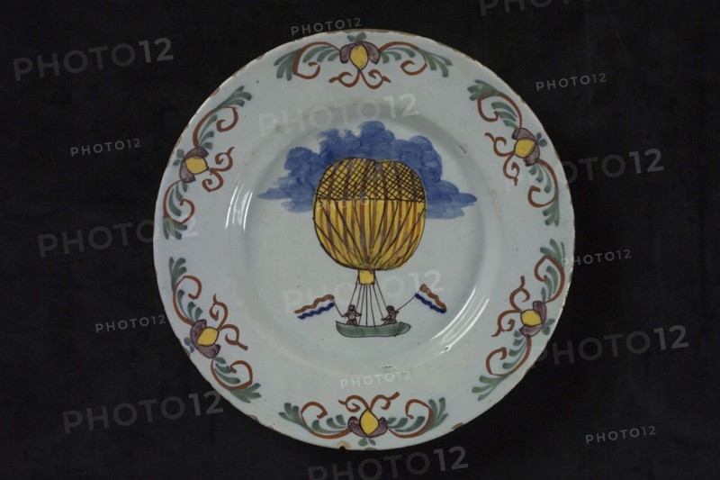 Light blue plate with multi-colored air balloon and border decoration, plate crockery holder ceramic earthenware glaze, baked