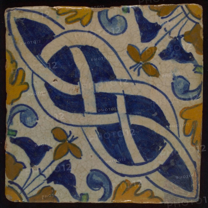Ornament tile, multicolored, in blue, yellow, brown and green on white ground, diagonally-colored basketwork with corner pattern
